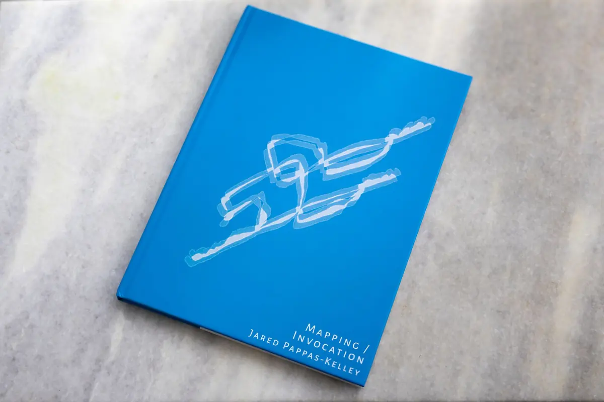 Blue cover of Mapping / Invocation, Jared Pappas-Kelley’s artist’s book
